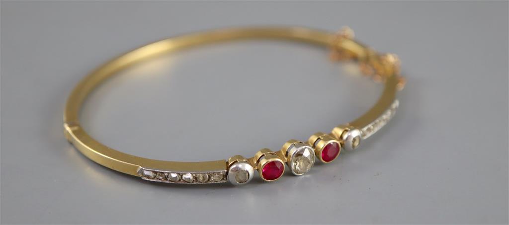 An Edwardian gold, ruby, old and rose cut diamond set hinged bracelet,